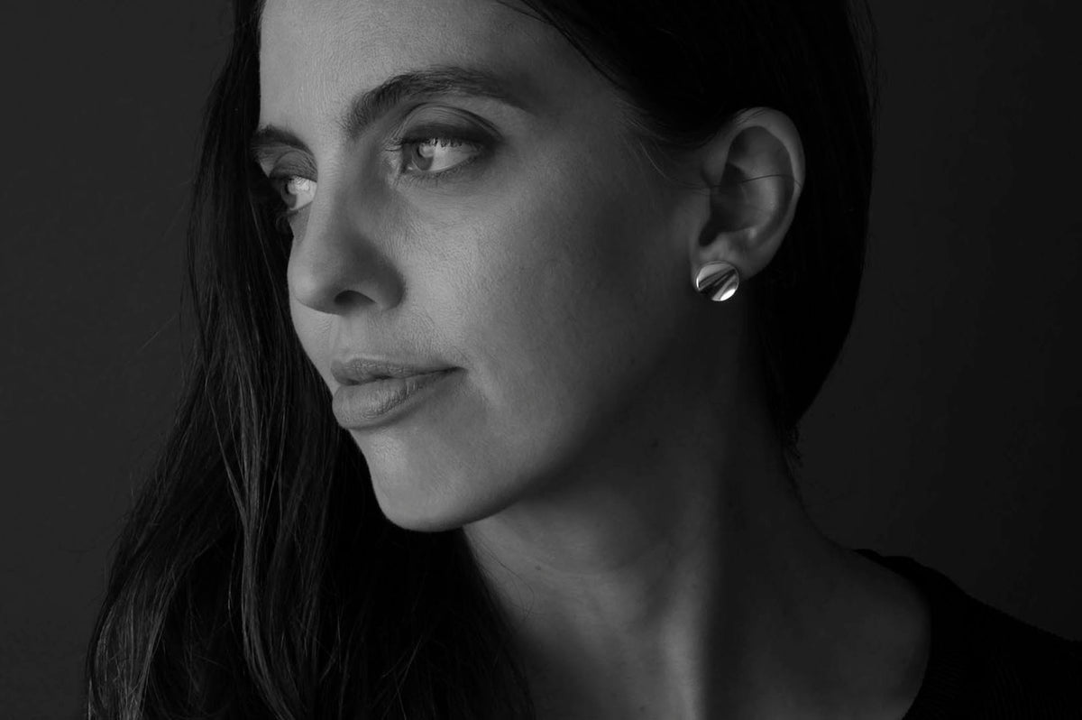 Woman Wearing Round Silver Earrings