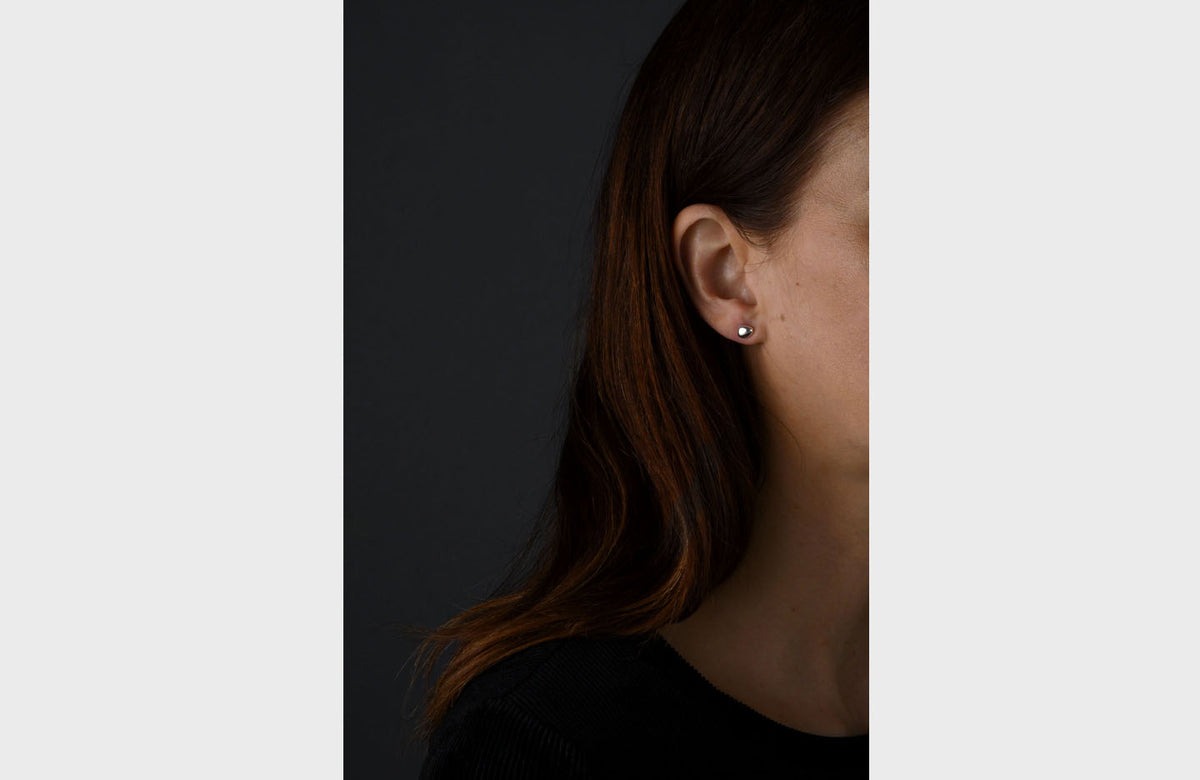 Woman Wearing Sterling Silver Pebble Earrings