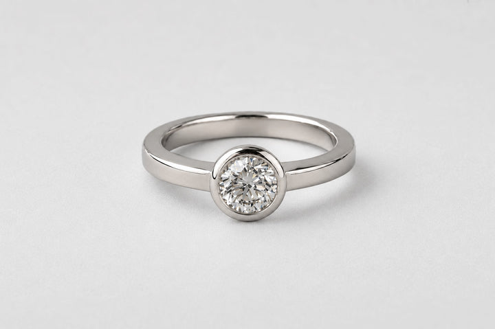BEZEL SET DIAMOND SOLITAIRE RING | 19K WHITE GOLD