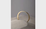 Round Bronze Bangle Styled in Sand